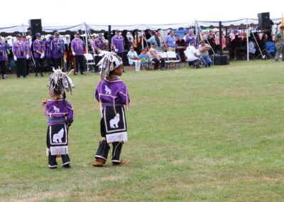 Two Native American boys dressed in purple at Marvin Joe Curry Pow Wow