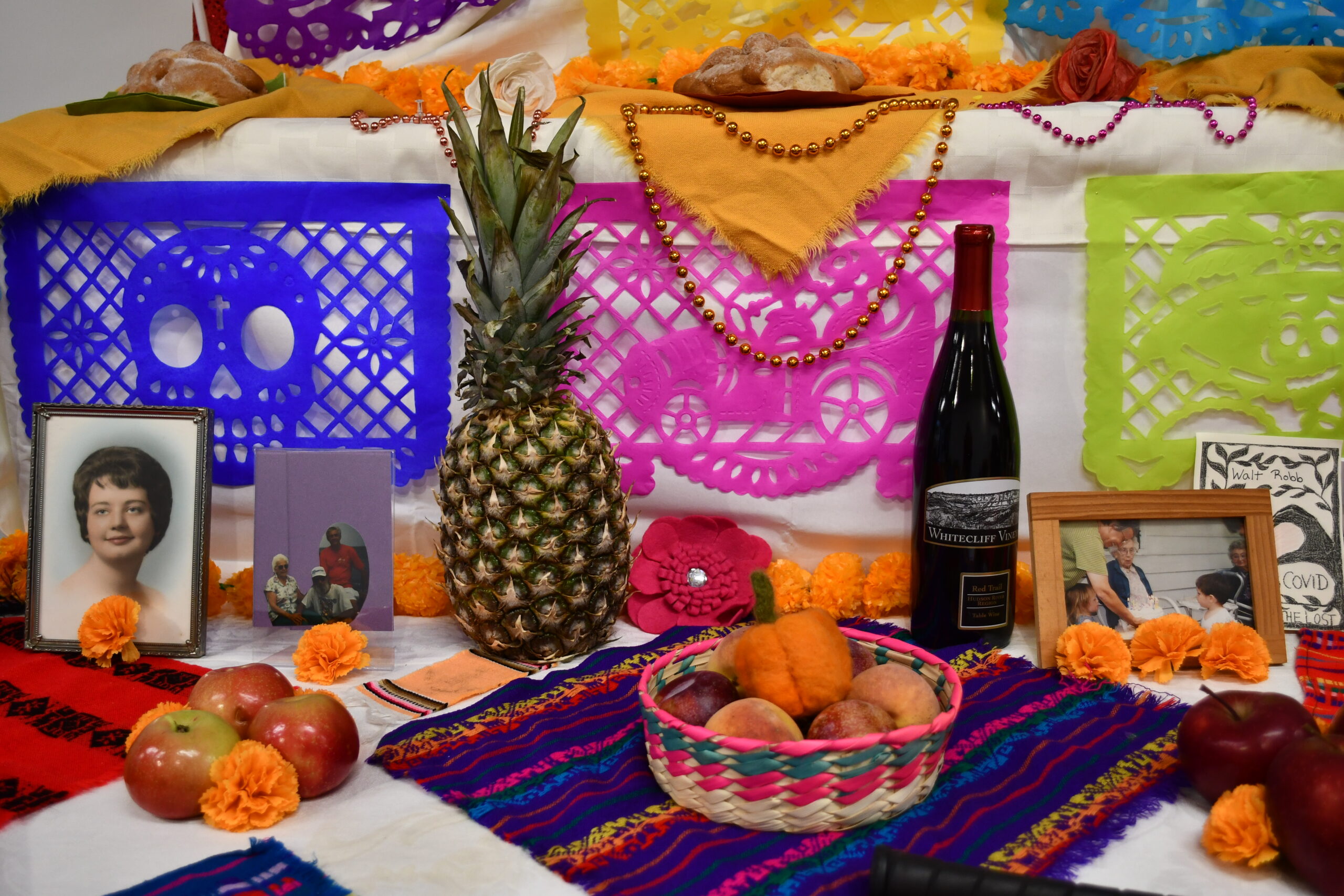 a snapshot of a colorful day of the dead altar.